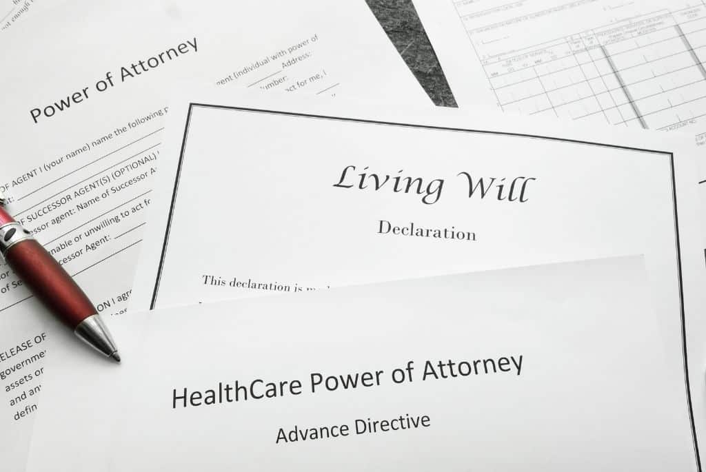 Living Will and Power of attorney documents laying on desk waiting for probate and trust & estate paralegals to review